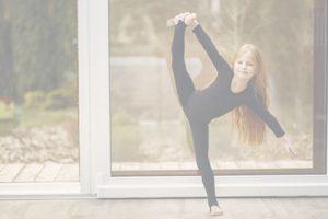 little-girl-black-sportswear-is-engaged-gymnastics_1157-31626
